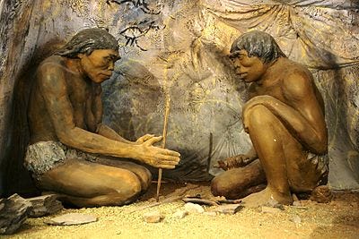 some cavemen attempt to make fire